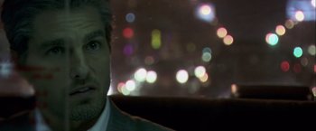 Movie still from “Collateral” (2004), directed by Michael Mann – A person in a car at night; Close Up shot, Over the shoulder angle
