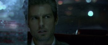 Movie still from “Collateral” (2004), directed by Michael Mann – A person wearing a suit and tie; Close Up shot, Over the shoulder angle