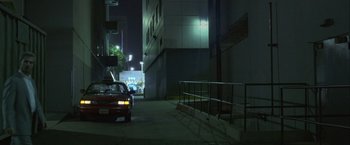 Movie still from “Collateral” (2004), directed by Michael Mann – A car parked on the side of the street at night; Extreme Wide shot, Low angle