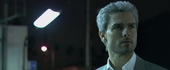 Movie still from “Collateral” (2004), directed by Michael Mann – A person wearing a white shirt; Close Up shot, Over the shoulder angle