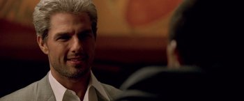 Movie still from “Collateral” (2004), directed by Michael Mann – A person sitting in front of another person; Close Up shot, Over the shoulder angle