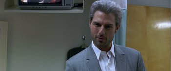 Movie still from “Collateral” (2004), directed by Michael Mann – A person wearing a suit and tie; Close Up shot, Over the shoulder angle