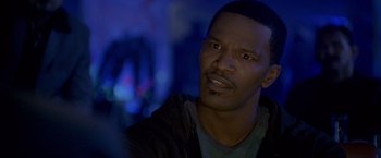 Movie still from “Collateral” (2004), directed by Michael Mann – A person wearing a jacket; Close Up shot, Over the shoulder angle