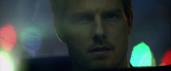 Movie still from “Collateral” (2004), directed by Michael Mann – A man's face in the dark; Extreme Close Up shot, Over the shoulder angle