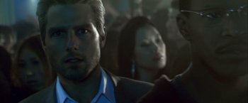 Movie still from “Collateral” (2004), directed by Michael Mann – A man and a woman are in a crowd; Close Up shot, Over the shoulder angle