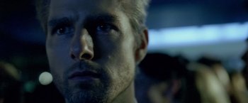 Movie still from “Collateral” (2004), directed by Michael Mann – A man's face in the dark; Close Up shot, Over the shoulder angle