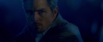 Movie still from “Collateral” (2004), directed by Michael Mann – A person wearing a suit and tie; Close Up shot, Over the shoulder angle