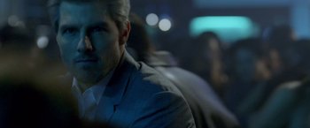 Movie still from “Collateral” (2004), directed by Michael Mann – A person wearing a suit; Close Up shot, Over the shoulder angle