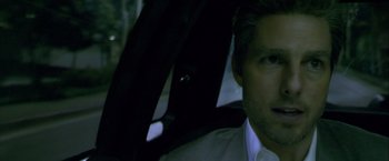 Movie still from “Collateral” (2004), directed by Michael Mann – A person sitting in a car; Close Up shot, Over the shoulder angle