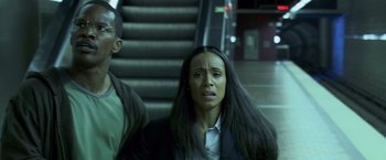 Movie still from “Collateral” (2004), directed by Michael Mann – A woman with long black hair standing in front of a staircase; Close Up shot, Low angle