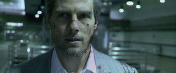 Movie still from “Collateral” (2004), directed by Michael Mann – A person wearing a suit and tie; Close Up shot, Over the shoulder angle