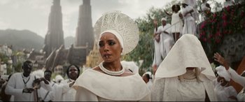 Movie still from “Black Panther: Wakanda Forever” (2022), directed by Ryan Coogler – A woman in a white dress and a white headpiece; Close Up shot, Low angle