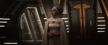 Movie still from “Black Panther: Wakanda Forever” (2022), directed by Ryan Coogler – A woman in a white dress and a headpiece; Medium shot, Low angle