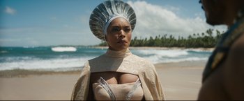 Movie still from “Black Panther: Wakanda Forever” (2022), directed by Ryan Coogler – A woman with a white headdress on the beach; Close Up shot, Low angle