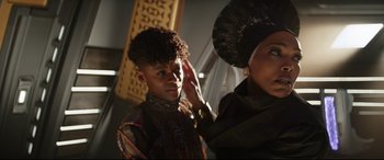Movie still from “Black Panther: Wakanda Forever” (2022), directed by Ryan Coogler – A man and a woman are standing next to each other; Close Up shot, Low angle