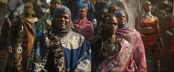 Movie still from “Black Panther: Wakanda Forever” (2022), directed by Ryan Coogler – A group of people standing next to each other; Medium shot, Over the shoulder angle