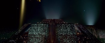 Movie still from “Blade Runner” (1982), directed by Ridley Scott – A building that is lit up at night time; Extreme Wide shot, Low angle