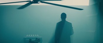 Movie still from “Blade Runner” (1982), directed by Ridley Scott – A man standing in front of a helicopter in the middle of the day; Wide shot, Low angle