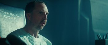 Movie still from “Blade Runner” (1982), directed by Ridley Scott – A person wearing a white t - shirt; Close Up shot, Low angle