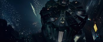 Movie still from “Blade Runner” (1982), directed by Ridley Scott – An aerial view of a city lit up at night; Extreme Wide shot, Overhead angle
