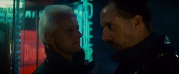 Movie still from “Blade Runner” (1982), directed by Ridley Scott – Two men face to face in a dark room; Close Up shot, Low angle