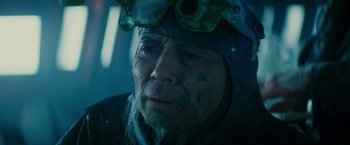 Movie still from “Blade Runner” (1982), directed by Ridley Scott – An older man wearing goggles and a jacket; Close Up shot, Low angle