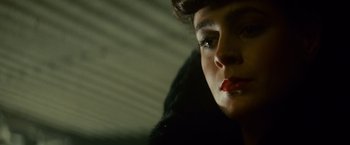 Movie still from “Blade Runner” (1982), directed by Ridley Scott – A woman's face in a dark room; Close Up shot, Low angle
