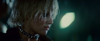 Movie still from “Blade Runner” (1982), directed by Ridley Scott – A person wearing a chain around their neck; Close Up shot, Over the shoulder angle