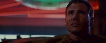 Movie still from “Blade Runner” (1982), directed by Ridley Scott – A person looking up at the sky; Close Up shot, Low angle