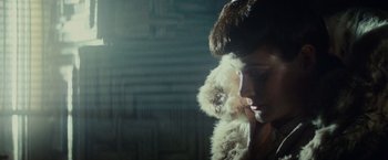 Movie still from “Blade Runner” (1982), directed by Ridley Scott – A woman in a fur hat and a fur coat; Close Up shot, Over the shoulder angle