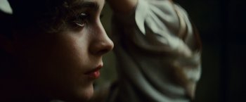 Movie still from “Blade Runner” (1982), directed by Ridley Scott – A woman's face in a dark room; Extreme Close Up shot, Low angle