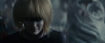 Movie still from “Blade Runner” (1982), directed by Ridley Scott – A person wearing a black shirt; Close Up shot, Over the shoulder angle