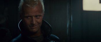 Movie still from “Blade Runner” (1982), directed by Ridley Scott – A person wearing a leather jacket; Close Up shot, Low angle