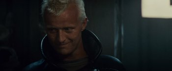 Movie still from “Blade Runner” (1982), directed by Ridley Scott – A person wearing a leather jacket; Close Up shot, Low angle