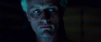 Movie still from “Blade Runner” (1982), directed by Ridley Scott – A person's face in the dark; Close Up shot, Low angle