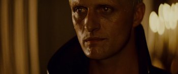 Movie still from “Blade Runner” (1982), directed by Ridley Scott – A man's face in a dimly - lit room; Close Up shot, High angle