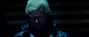 Movie still from “Blade Runner” (1982), directed by Ridley Scott – A person wearing a jacket; Close Up shot, Low angle