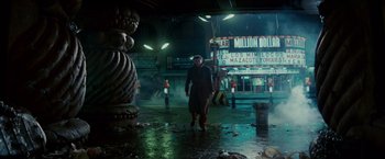 Movie still from “Blade Runner” (1982), directed by Ridley Scott – A man standing in the middle of a street; Wide shot, Low angle