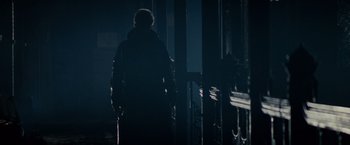 Movie still from “Blade Runner” (1982), directed by Ridley Scott – A man walking in the dark holding a cane; Wide shot, Low angle