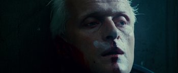 Movie still from “Blade Runner” (1982), directed by Ridley Scott – A person with a face paint; Extreme Close Up shot, Overhead angle