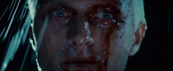 Movie still from “Blade Runner” (1982), directed by Ridley Scott – A man's face covered in blood; Extreme Close Up shot, Overhead angle