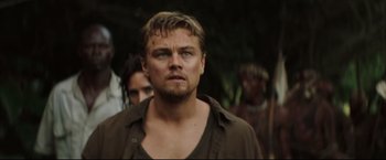 Movie still from “Blood Diamond” (2006), directed by Edward Zwick – A person wearing a shirt; Close Up shot, Over the shoulder angle