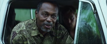 Movie still from “Blood Diamond” (2006), directed by Edward Zwick – An older man and a younger woman in a car; Close Up shot, Over the shoulder angle