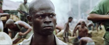Movie still from “Blood Diamond” (2006), directed by Edward Zwick – A person wearing a white shirt; Close Up shot, Low angle