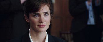 Movie still from “Blood Diamond” (2006), directed by Edward Zwick – A person wearing a suit and tie; Close Up shot, Over the shoulder angle