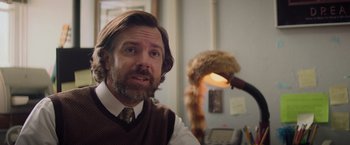 Movie still from “Booksmart” (2019), directed by Olivia Wilde – A man in a brown vest and a brown tie; Close Up shot, Over the shoulder angle