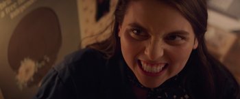 Movie still from “Booksmart” (2019), directed by Olivia Wilde – A woman's face with an angry look; Close Up shot, High angle