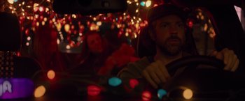 Movie still from “Booksmart” (2019), directed by Olivia Wilde – A man and a woman in a car at night; Close Up shot, Low angle