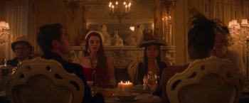 Movie still from “Booksmart” (2019), directed by Olivia Wilde – Two women sitting at a table with a lit candle; Medium shot, Low angle