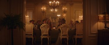 Movie still from “Booksmart” (2019), directed by Olivia Wilde – A group of people sitting at a dinner table; Wide shot, High angle